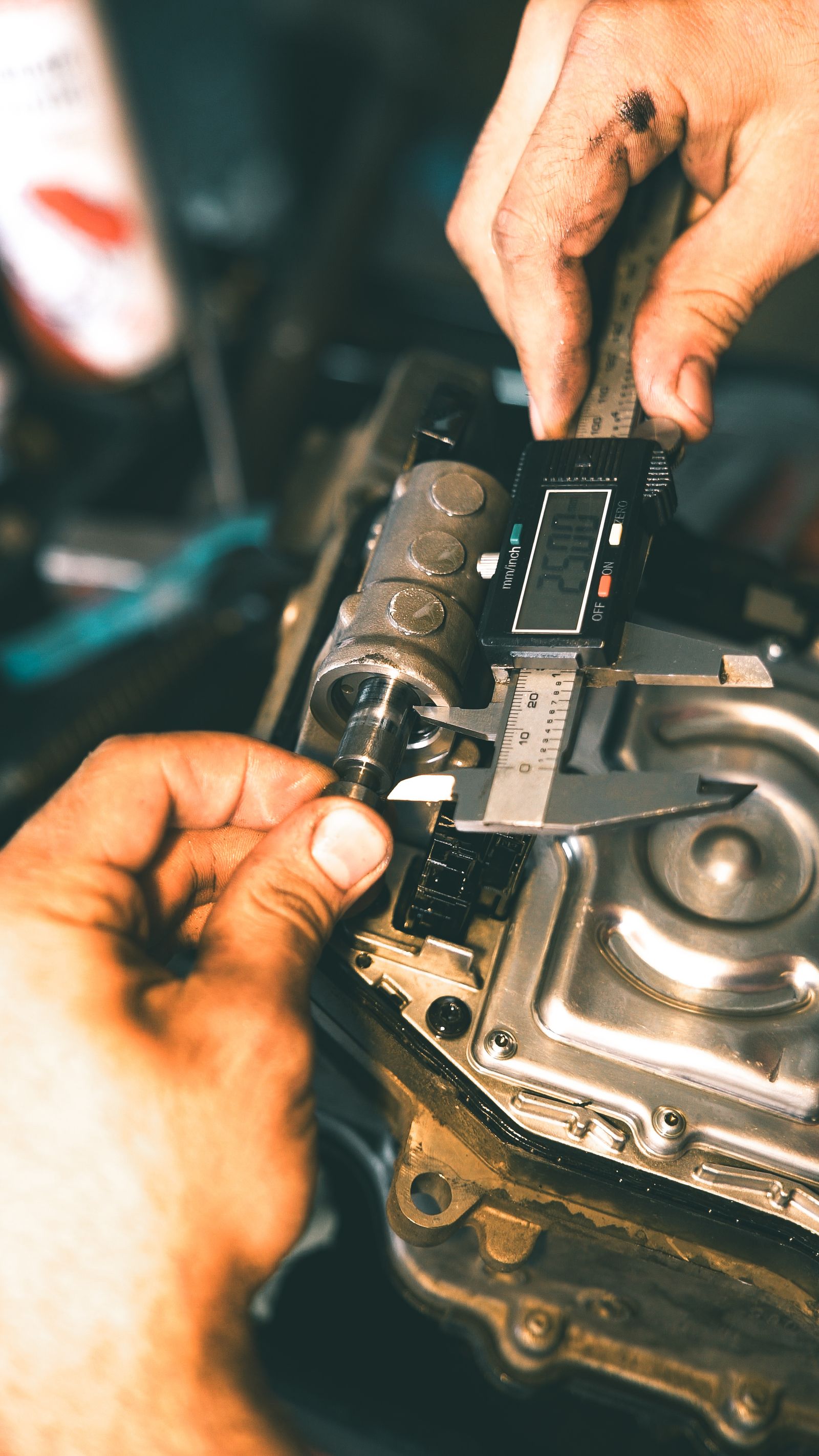 Digital caliper measuring a component during product inspection